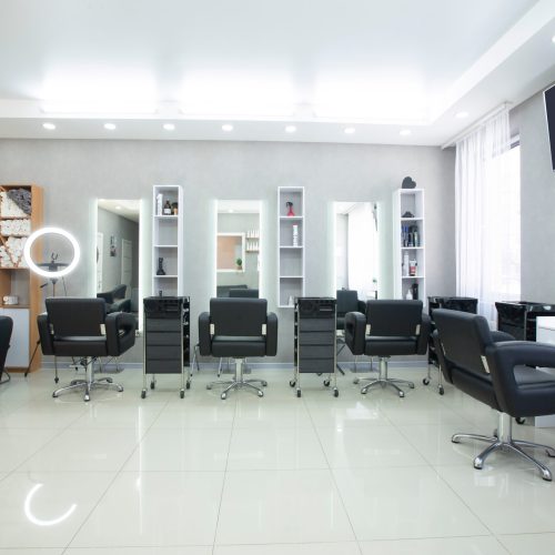 Hairdressing procedures in luxe beauty salon, panorama, free space